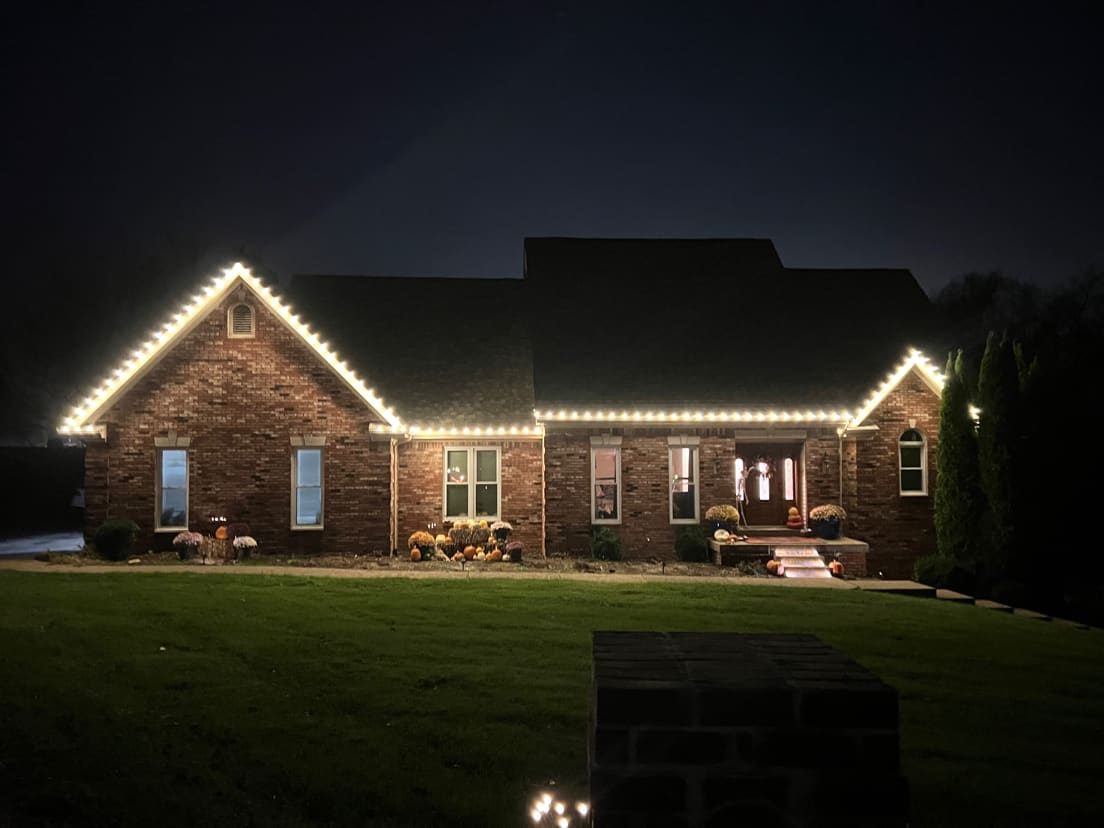 Home in Floyds Knobs, IN with professional Christmas roofline lighting installed by Elite Exteriors