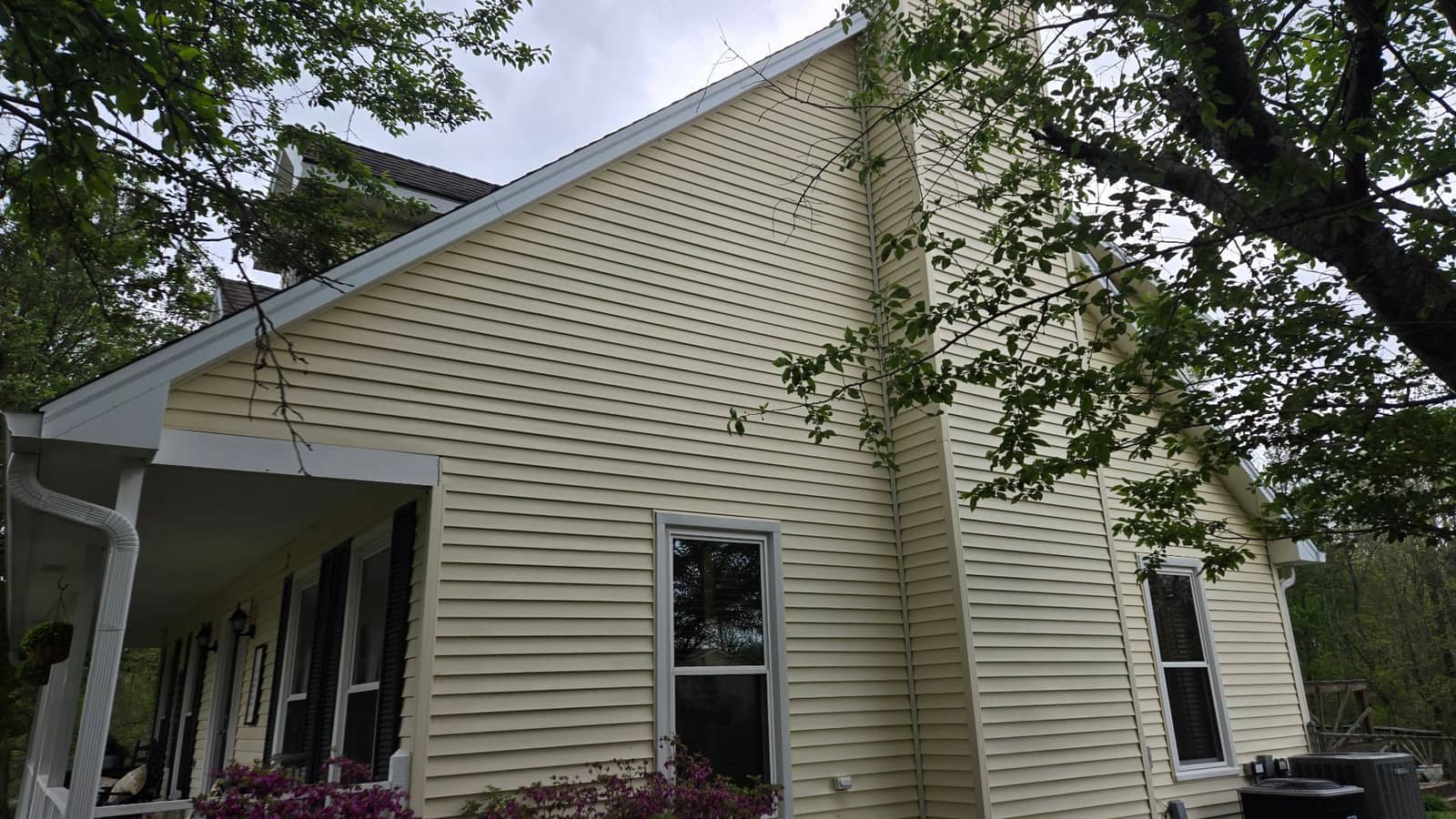 Freshly cleaned residential siding after professional soft-wash house washing by Elite Exteriors in Floyds Knobs, IN