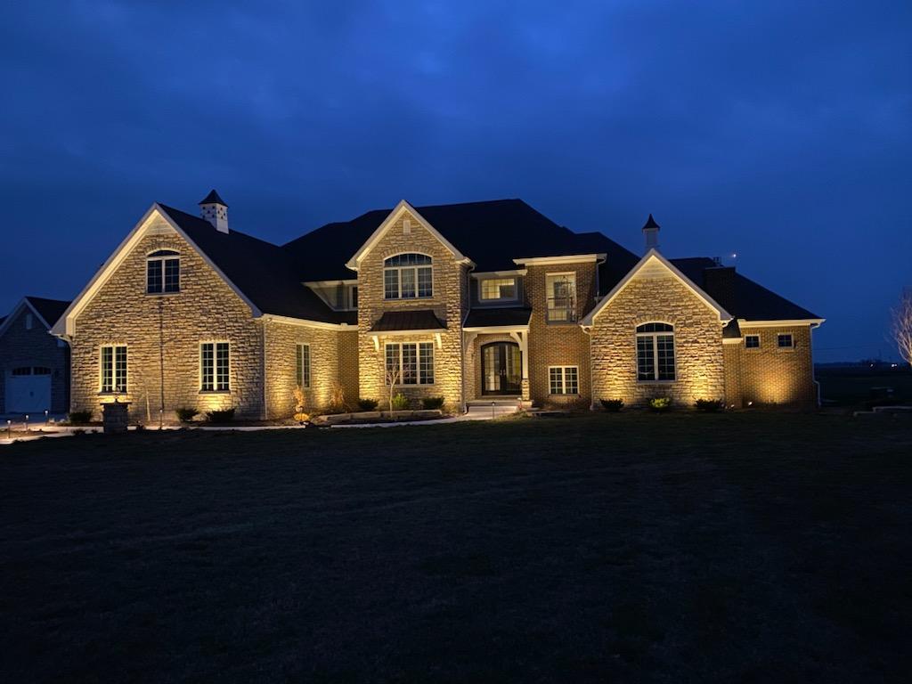 Estate home with pathway and architectural landscape lighting by Elite Exteriors in Floyds Knobs, IN