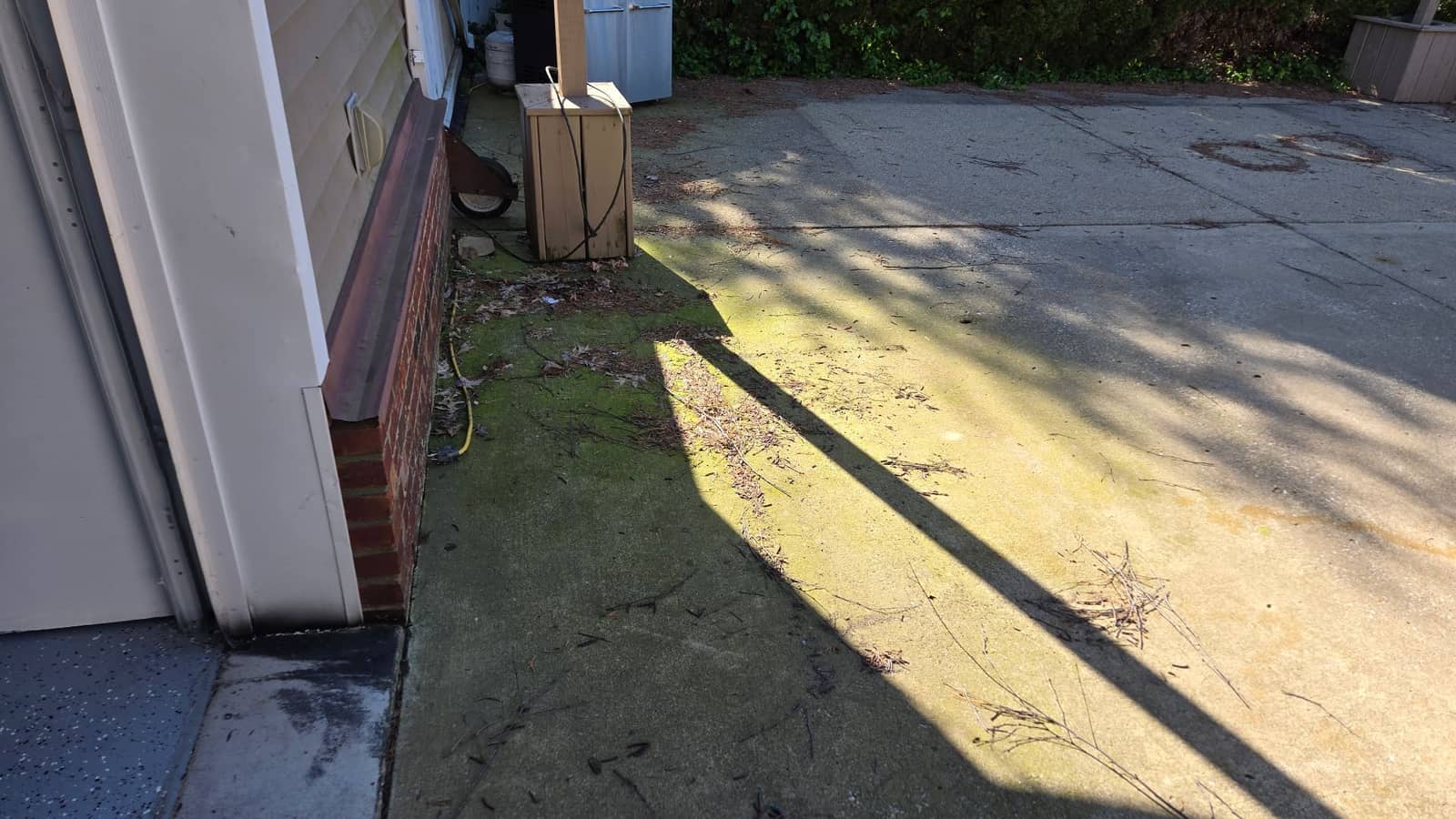 Pressure Washing in Southern Indiana before Elite Exteriors service — Driveway Transformation